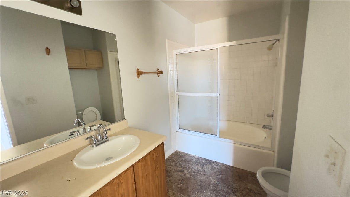 543 KRISTIN Lane, Henderson, NV 89011 Functional bathroom layout features a shower-tub combination and a wood-finished vanity.