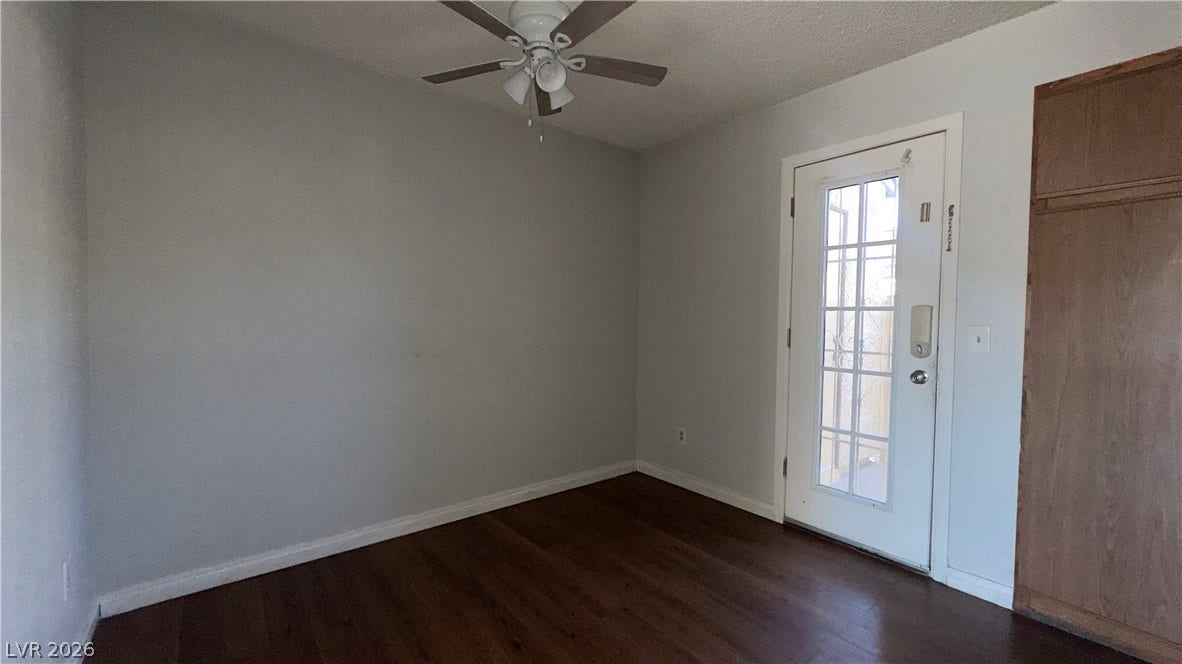 543 KRISTIN Lane, Henderson, NV 89011 Rich wood floors lay a warm foundation below crisp trim and a glass-paneled door.