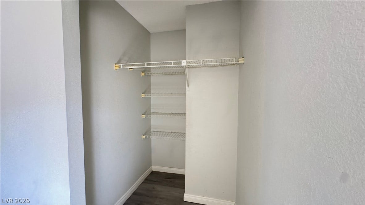 543 KRISTIN Lane, Henderson, NV 89011 Ample wire shelving configures this functional storage space with dark wood-inspired flooring.