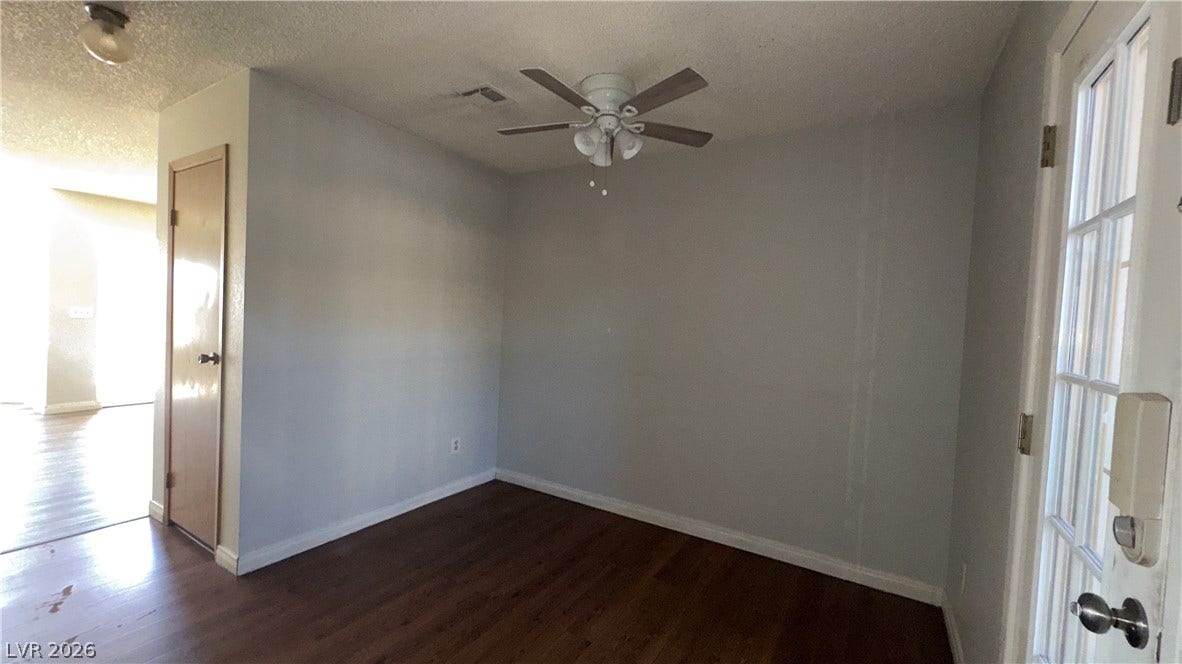 543 KRISTIN Lane, Henderson, NV 89011 Rich hardwood floors anchor this versatile room, offering easy access to the home's main entry.