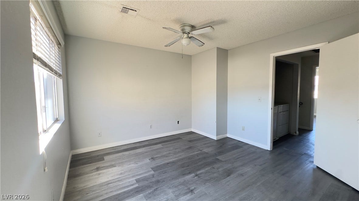 543 KRISTIN Lane, Henderson, NV 89011 Gleaming wood-look floors anchor this versatile room illuminated by natural light.