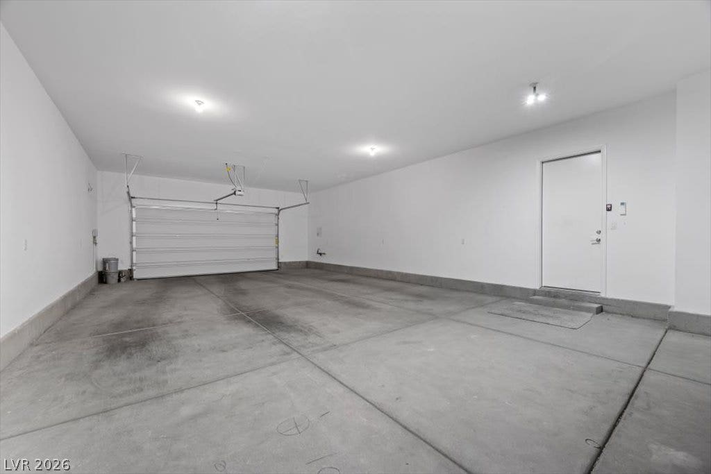 An attached 4-car garage provides direct home access.