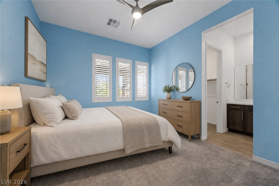 An inviting bedroom features plush carpeting, classic plantation shutters, and an attached access to bath. virtually staged