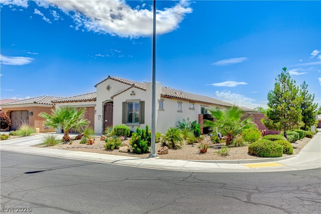 3605 Greenbriar Bluff Avenue, North Las Vegas, NV 89081 Desert landscaping and a tile roof define this modern single-story residence.