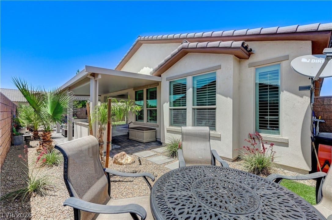3605 Greenbriar Bluff Avenue, North Las Vegas, NV 89081 An inviting covered patio integrates seamlessly with the surrounding low-maintenance desert landscaping.
