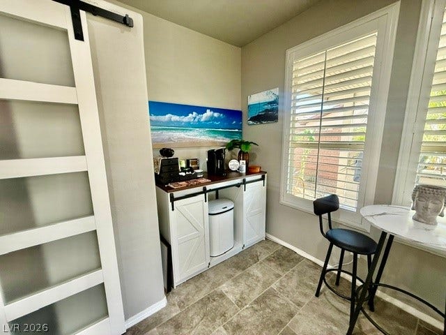 3605 Greenbriar Bluff Avenue, North Las Vegas, NV 89081 A charming morning nook features textured tile flooring and large windows with plantation shutters.