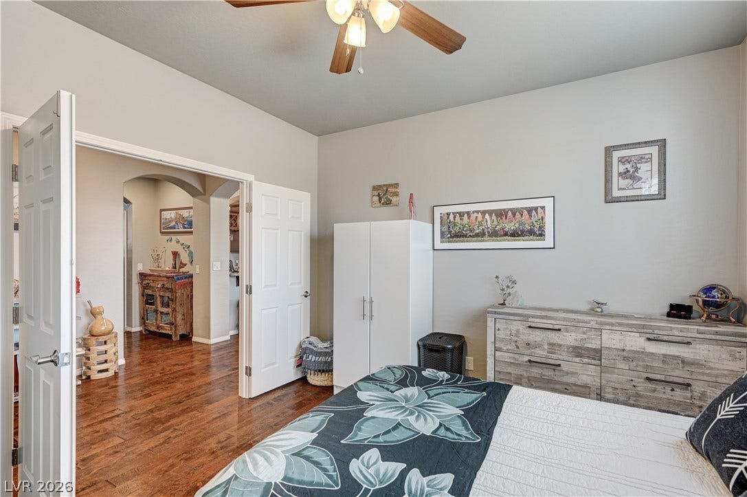 3605 Greenbriar Bluff Avenue, North Las Vegas, NV 89081 Hardwood flooring flows seamlessly from the bedroom into the main living areas.