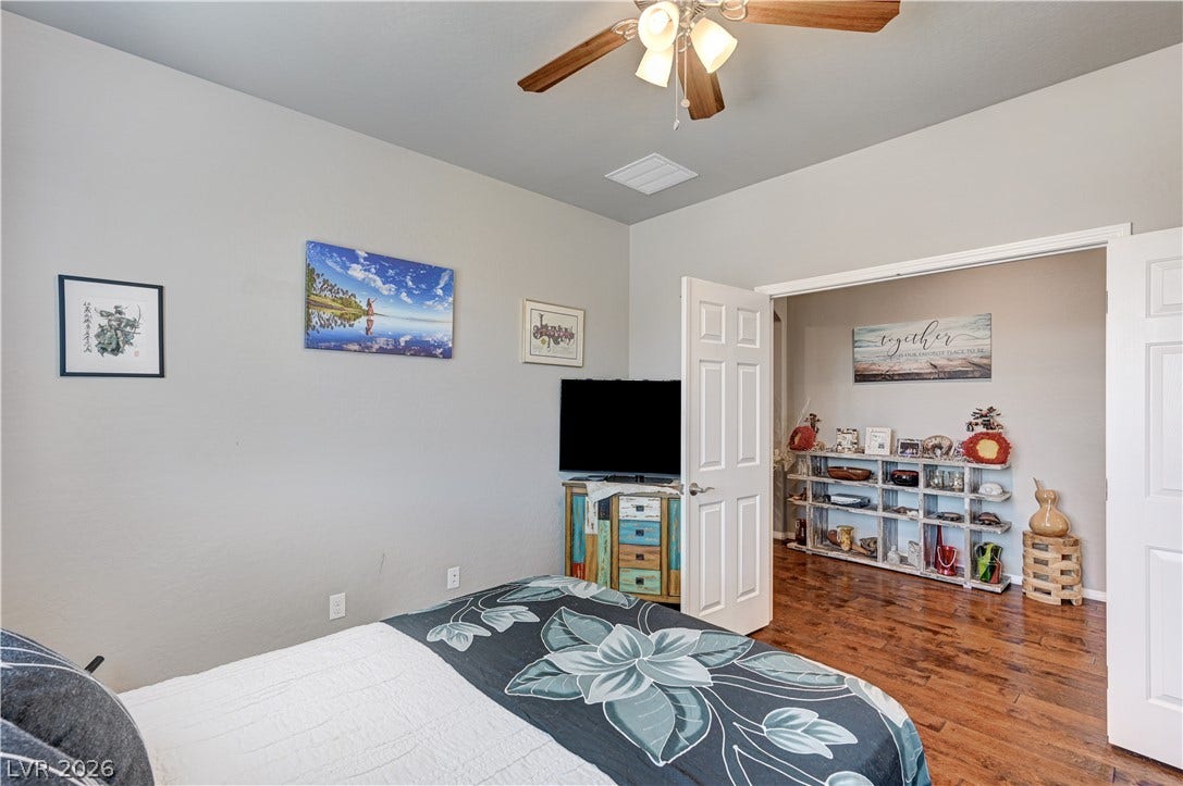3605 Greenbriar Bluff Avenue, North Las Vegas, NV 89081 Gleaming hardwood floors run through this inviting bedroom into the adjoining space.