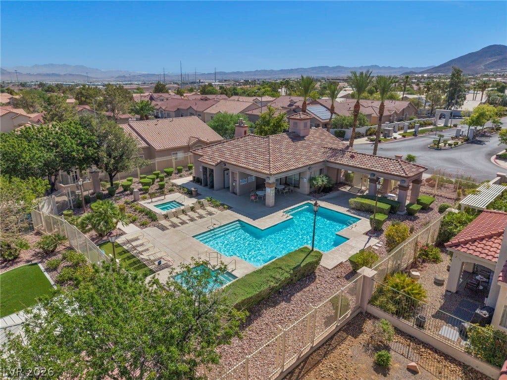 1745 Lily Pond Circle, Henderson, NV 89012 An inviting swimming pool and spa area are nestled within a beautifully landscaped desert community.