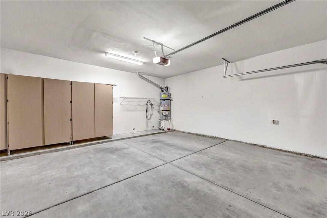 1745 Lily Pond Circle, Henderson, NV 89012 Ample storage cabinetry and smooth concrete flooring define this highly functional garage space.