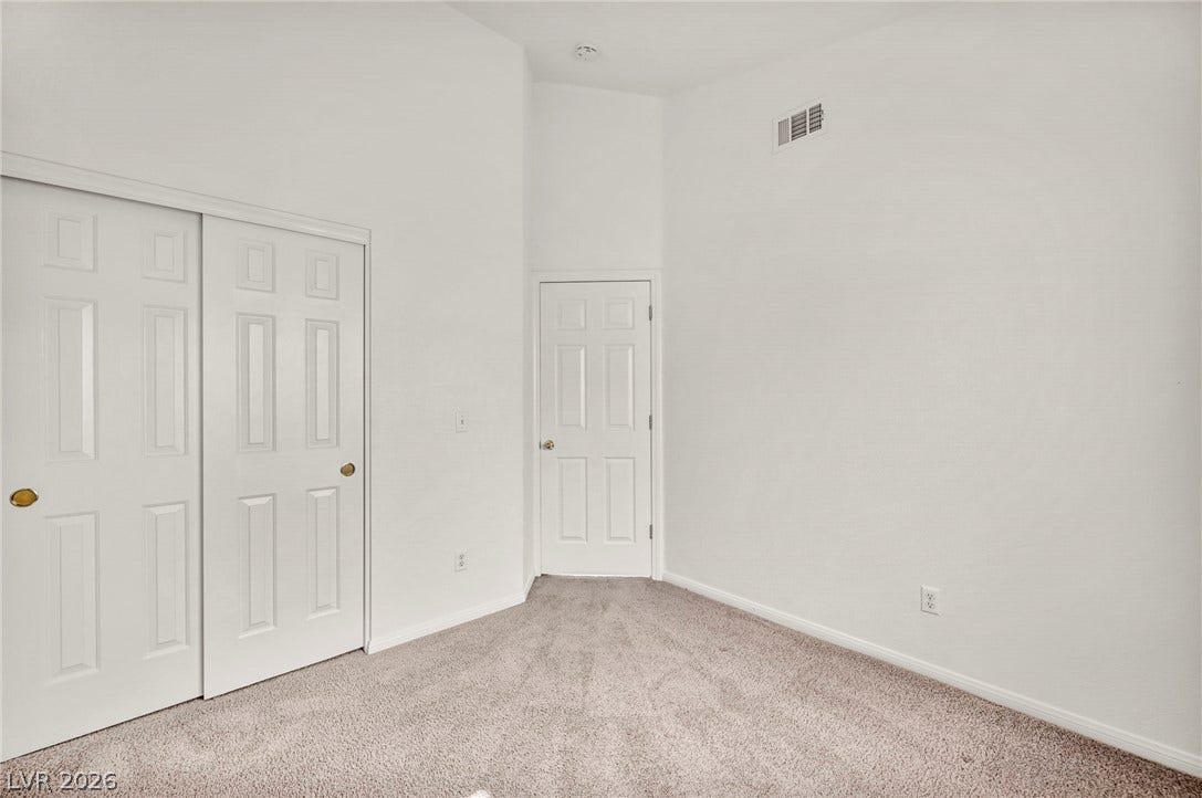 1745 Lily Pond Circle, Henderson, NV 89012 A high vaulted ceiling and soft carpeting enhance this tranquil bedroom space.