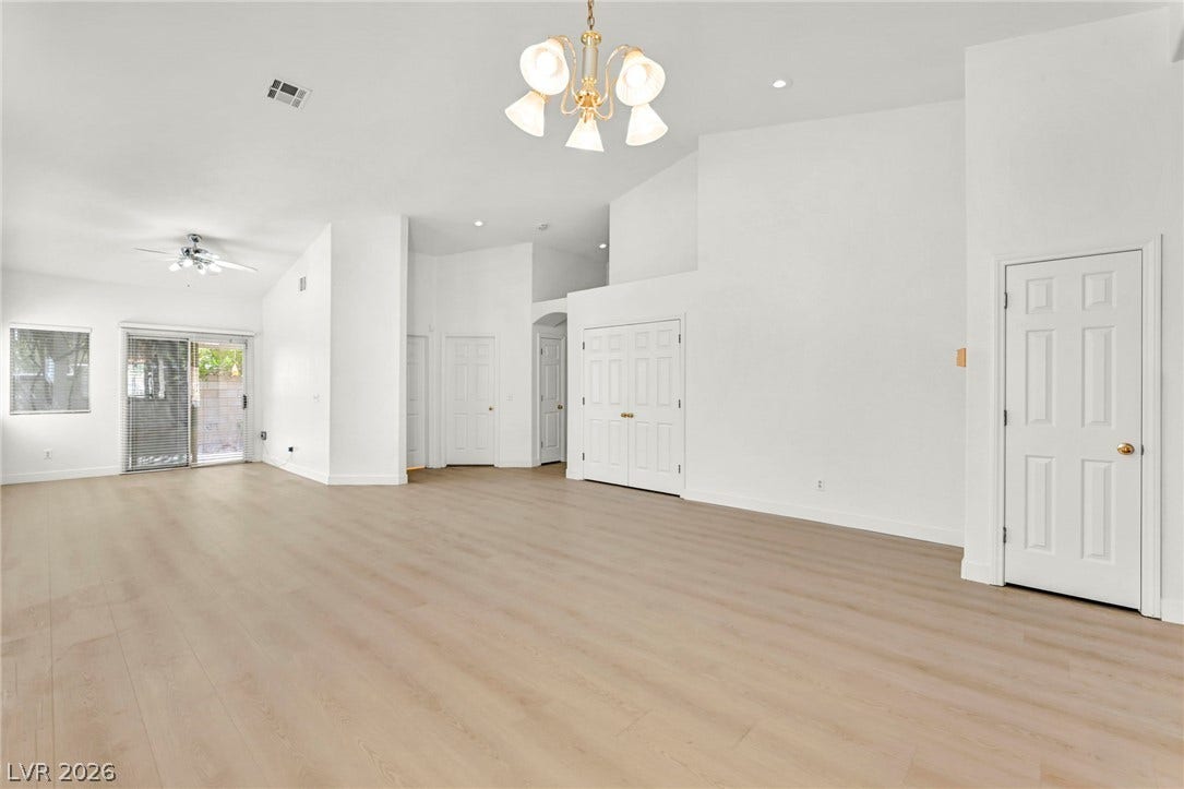 1745 Lily Pond Circle, Henderson, NV 89012 Smooth wood floors flow beneath high ceilings in this open, airy living space.