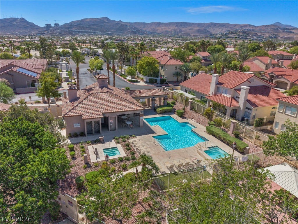 1745 Lily Pond Circle, Henderson, NV 89012 A sparkling community pool complex overlooks the surrounding neighborhood and desert mountains.