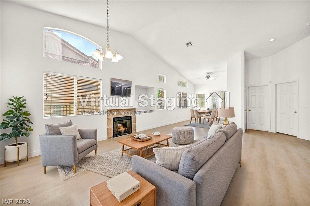 1745 Lily Pond Circle, Henderson, NV 89012 Vaulted ceilings and wide-plank flooring frame the inviting fireplace in this open living area.