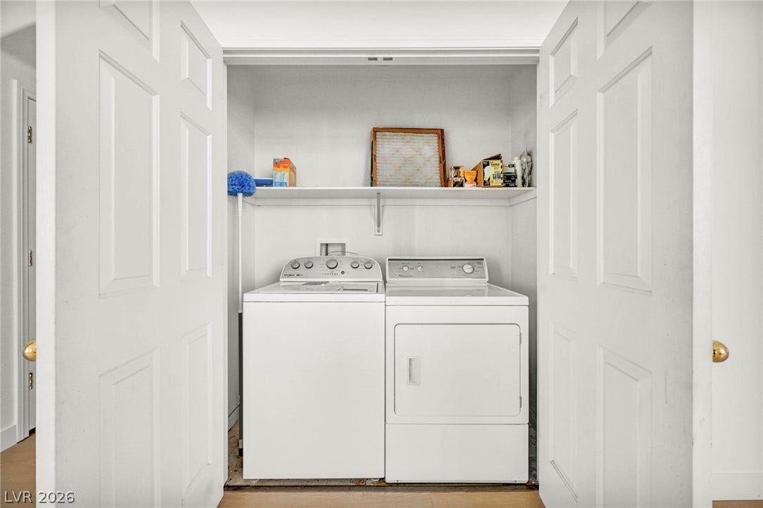 1745 Lily Pond Circle, Henderson, NV 89012 Double doors open to reveal a convenient laundry closet with built-in shelving.