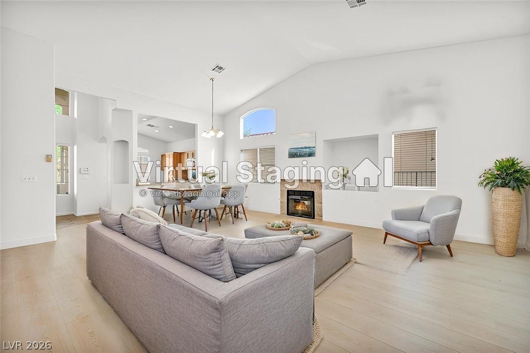 1745 Lily Pond Circle, Henderson, NV 89012 Soaring vaulted ceilings and a classic fireplace anchor this open and airy living space.