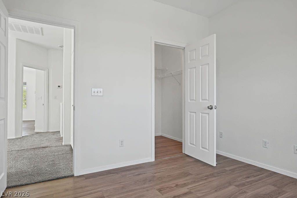 754 Solitude Point Avenue, Henderson, NV 89012 Smooth wood-look flooring and crisp white trim define this light-filled room with built-in storage.