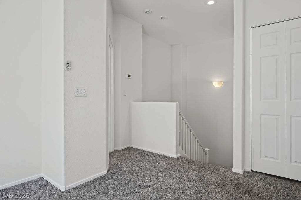 754 Solitude Point Avenue, Henderson, NV 89012 An upper landing features plush carpeting and leads directly to the staircase.