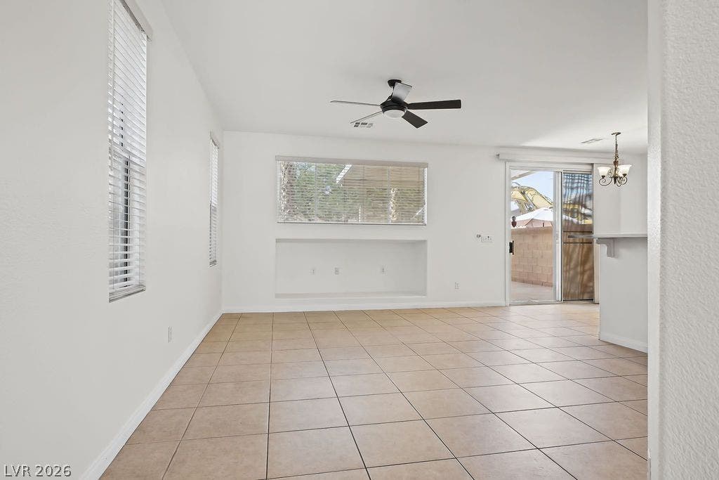 754 Solitude Point Avenue, Henderson, NV 89012 Clean tile flooring and a neutral color palette enhance this open living layout.