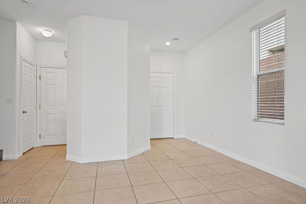 754 Solitude Point Avenue, Henderson, NV 89012 Tiled flooring and natural window light enhance this versatile entryway.