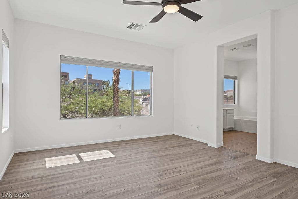 754 Solitude Point Avenue, Henderson, NV 89012 Smooth wood floors and wide windows frame pleasant views of the surrounding neighborhood.