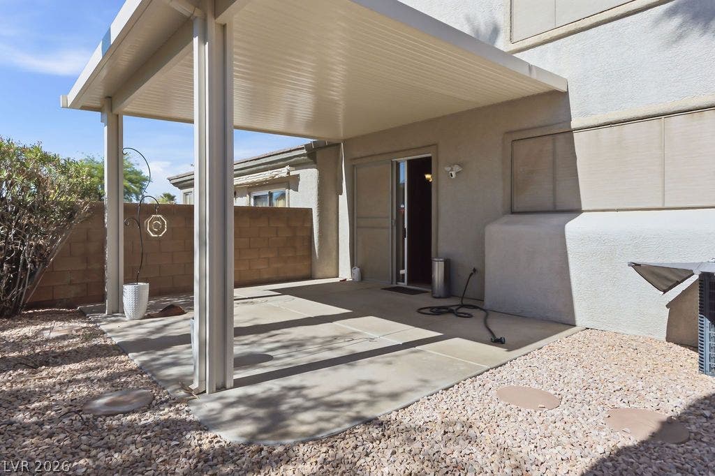 754 Solitude Point Avenue, Henderson, NV 89012 A spacious covered concrete patio provides sheltered outdoor living space along the back of the home.