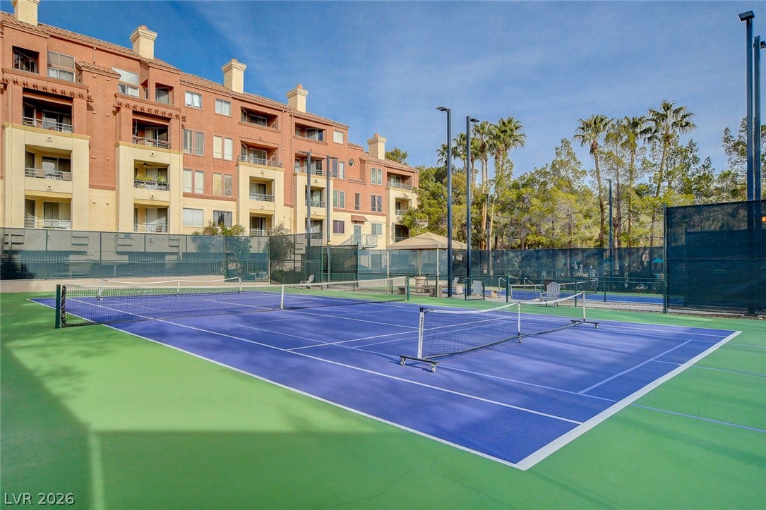 Fenced courts provide an ideal space for recreation adjacent to the residential building.