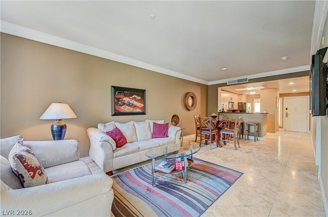 An open floorplan seamlessly connects the living space to the dining area and kitchen.