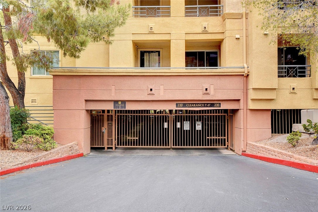 Secure gated access leads directly to the subterranean parking garage beneath the residential building.