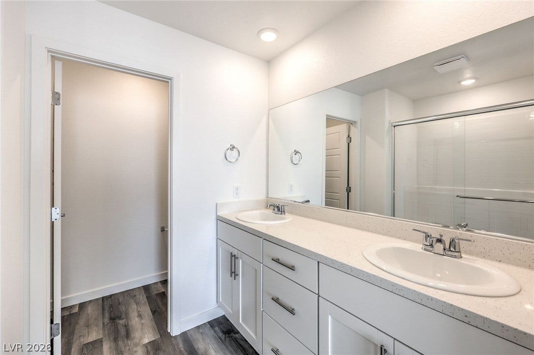 7339 TANYA FALLS Street, North Las Vegas, NV 89084 Photo is of a 1550 Plan Production Home Within the Community- NOT THE ACTUAL HOME FOR SALE *material/features/colors can vary & are subject to change*