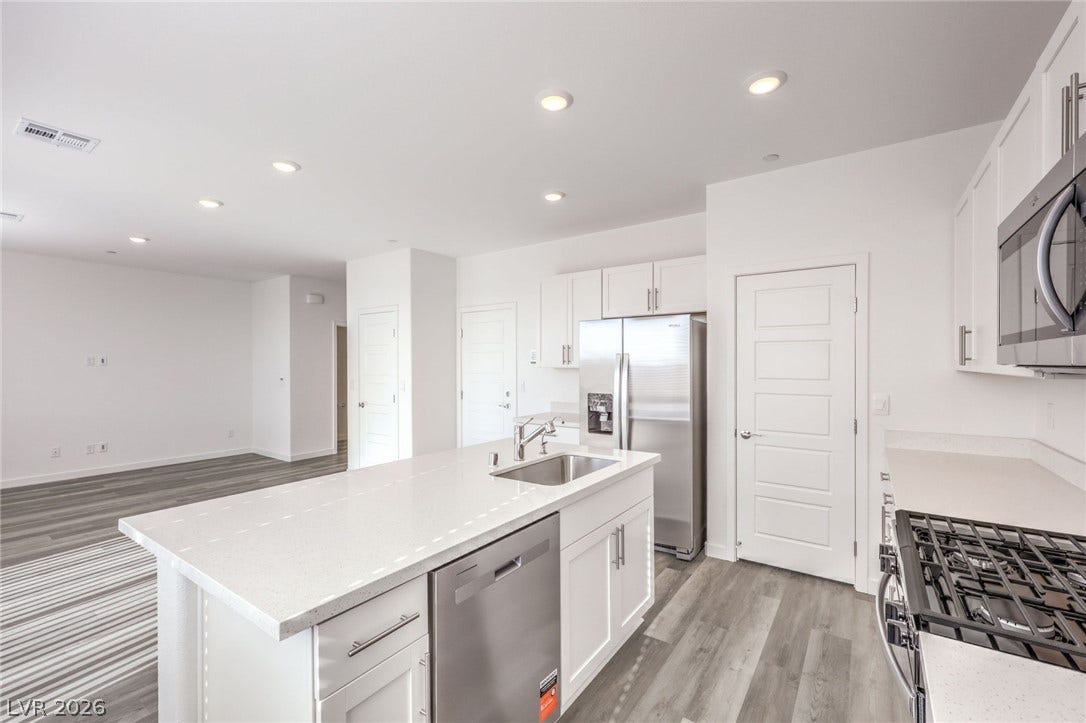 7339 TANYA FALLS Street, North Las Vegas, NV 89084 Photo is of a 1550 Plan Production Home Within the Community- NOT THE ACTUAL HOME FOR SALE *material/features/colors can vary & are subject to change*