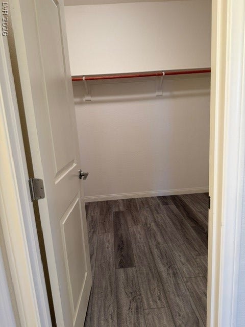 10764 Canary Blossom Avenue, Las Vegas, NV 89129 An organized closet space features durable wood-look flooring and built-in shelving.