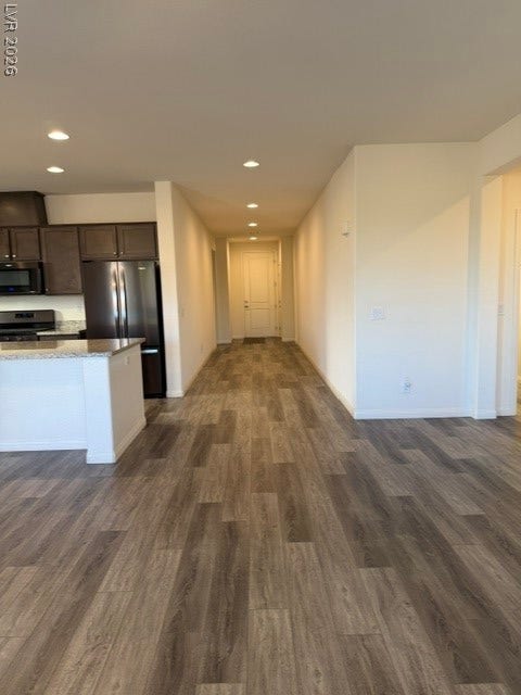 10764 Canary Blossom Avenue, Las Vegas, NV 89129 Smooth wood-plank flooring runs throughout this modern open layout.