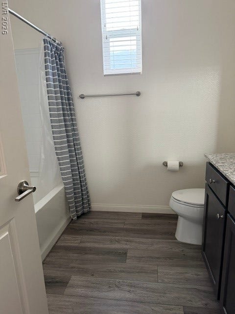 10764 Canary Blossom Avenue, Las Vegas, NV 89129 Plank flooring and a classic tub shower assembly define this pristine bathroom.