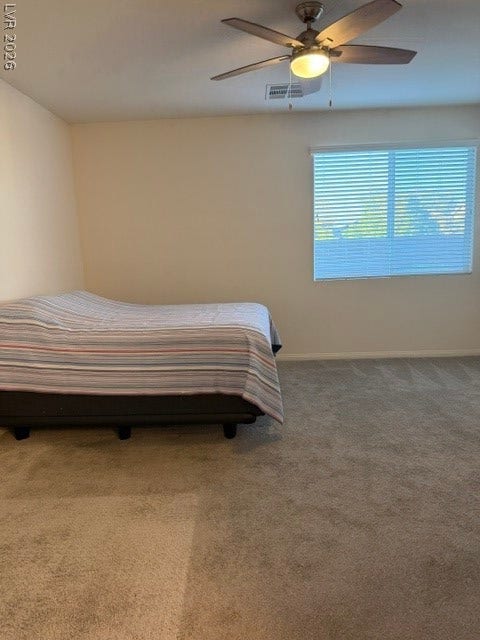 10764 Canary Blossom Avenue, Las Vegas, NV 89129 Soft carpeting underfoot defines this comfortable bedroom complete with a wide window.