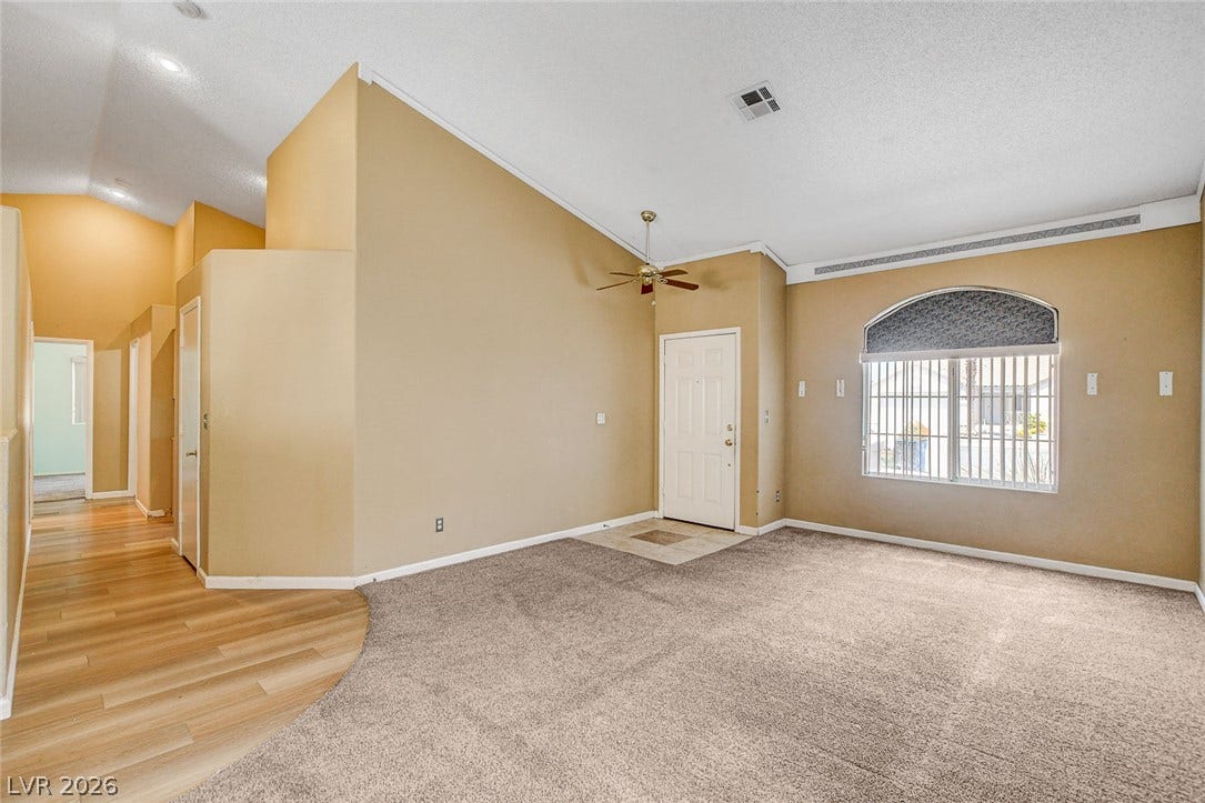 811 Rio Poco Court, Henderson, NV 89015 Vaulted ceilings and arched window lines define this airy entry and living space.