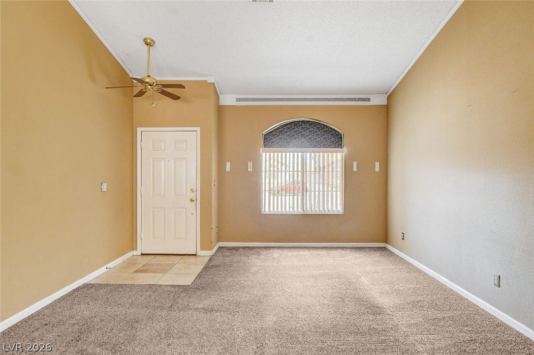 811 Rio Poco Court, Henderson, NV 89015 High ceilings and soft carpeting create a welcoming ambiance in this versatile living space.