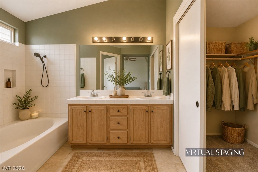 811 Rio Poco Court, Henderson, NV 89015 An inviting bathroom pairs a double vanity with an adjacent walk-in closet.