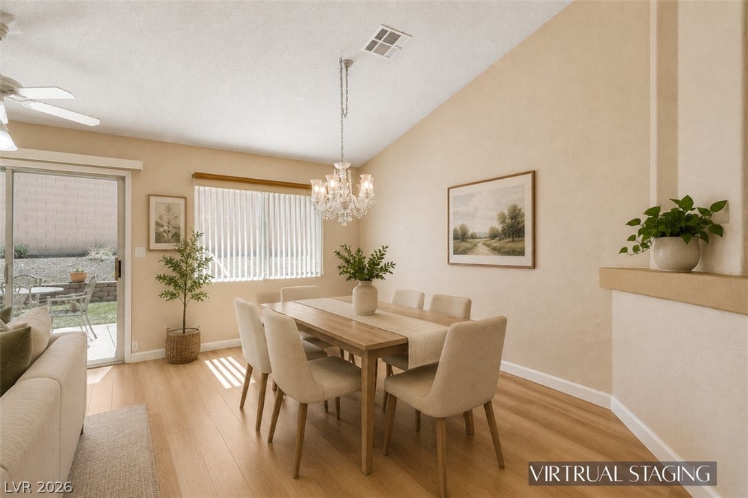 811 Rio Poco Court, Henderson, NV 89015 A vaulted ceiling and warm wood flooring define this inviting dining room space.