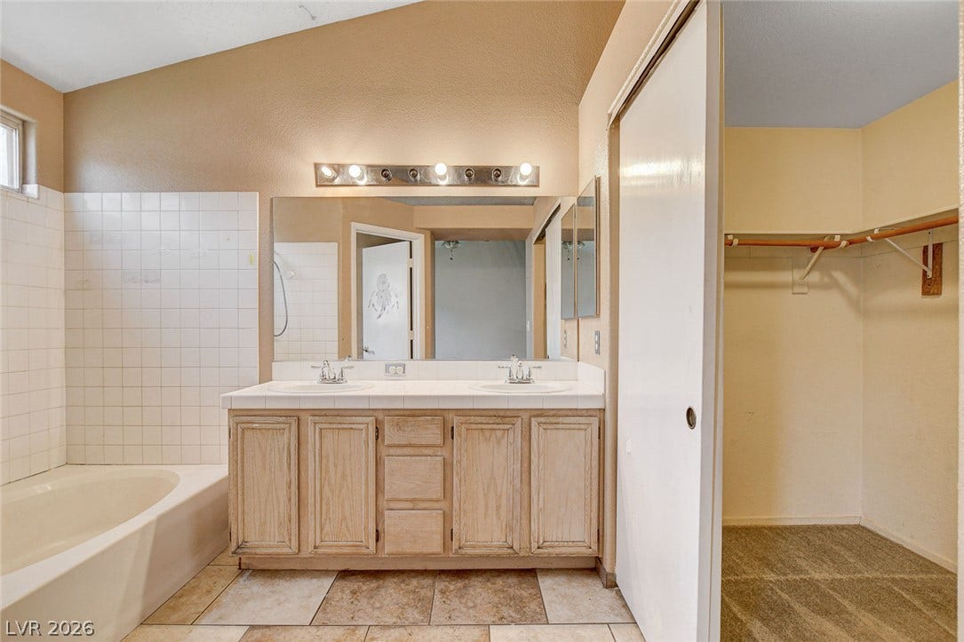 811 Rio Poco Court, Henderson, NV 89015 A spacious vanity area connects seamlessly to an adjacent walk-in closet.