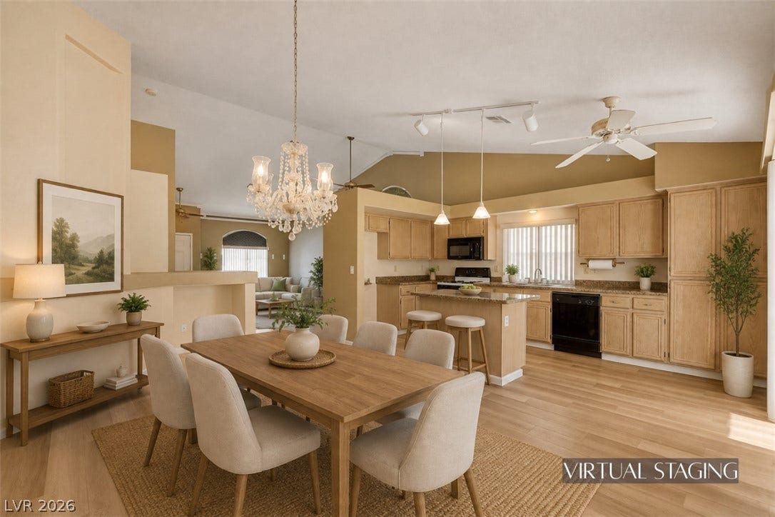 811 Rio Poco Court, Henderson, NV 89015 An open floorplan seamlessly connects the dining space to a kitchen with vaulted ceilings.