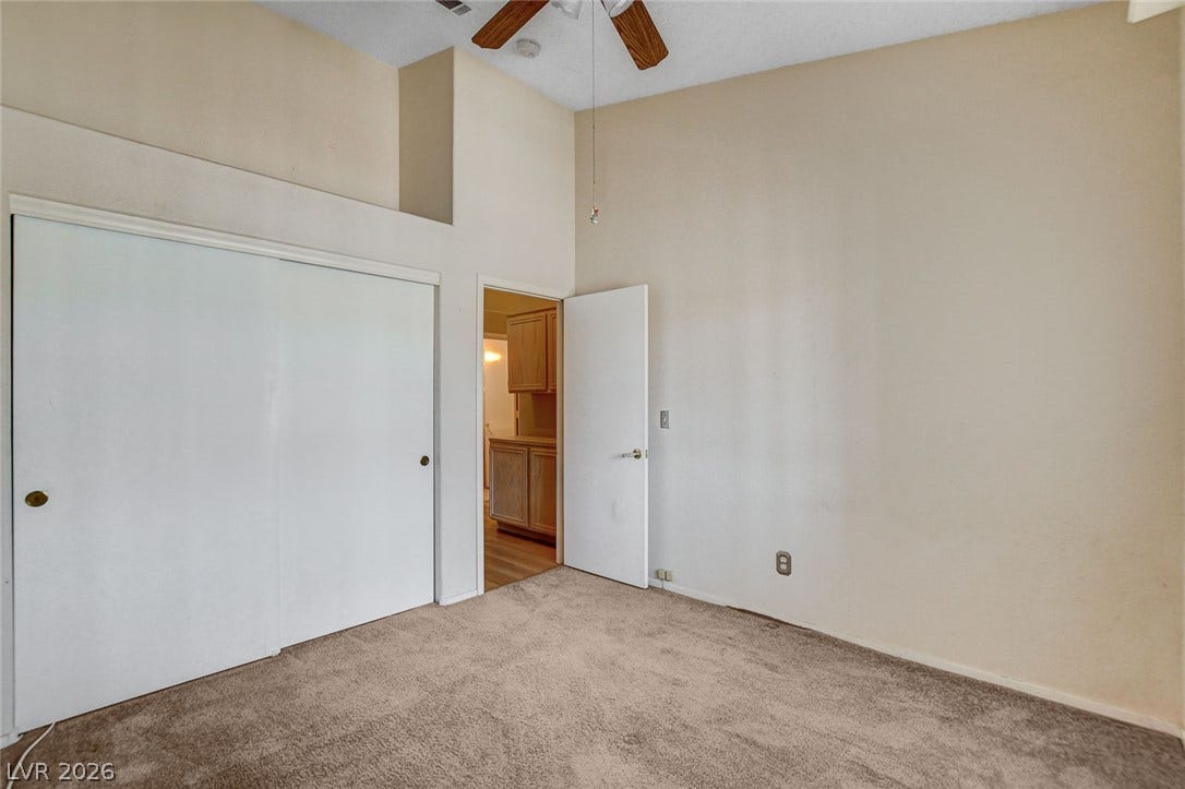 811 Rio Poco Court, Henderson, NV 89015 High vaulted ceilings and soft neutral carpeting define this airy bedroom space.