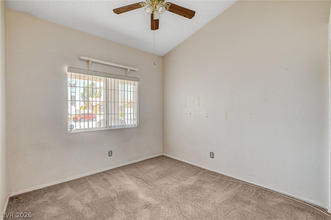 811 Rio Poco Court, Henderson, NV 89015 Vaulted ceilings and soft carpeting create a comfortable atmosphere in this versatile bedroom space.