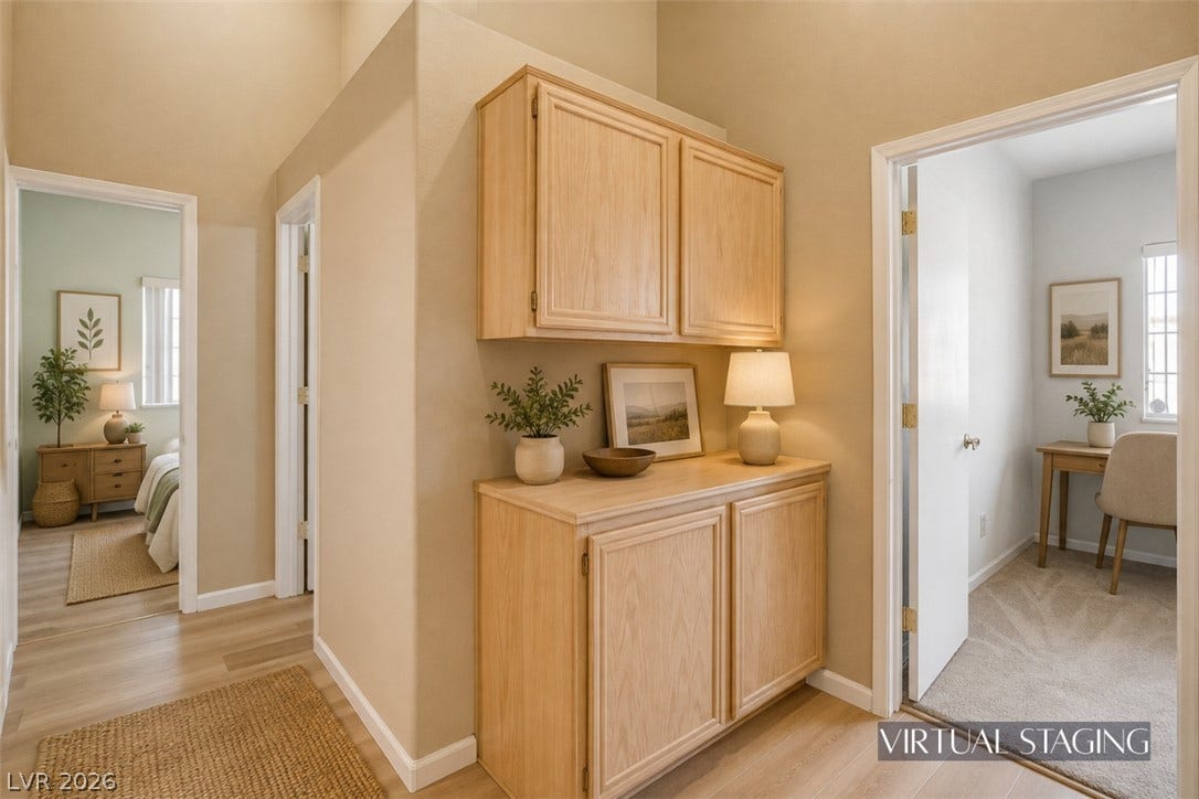811 Rio Poco Court, Henderson, NV 89015 High ceilings and built-in wood cabinetry anchor this versatile hallway transition space.