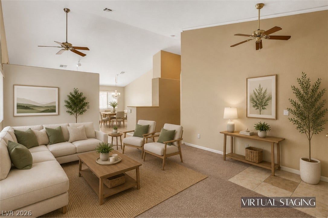 811 Rio Poco Court, Henderson, NV 89015 An open floorplan displays soaring vaulted ceilings and neutral carpeting throughout the main level.