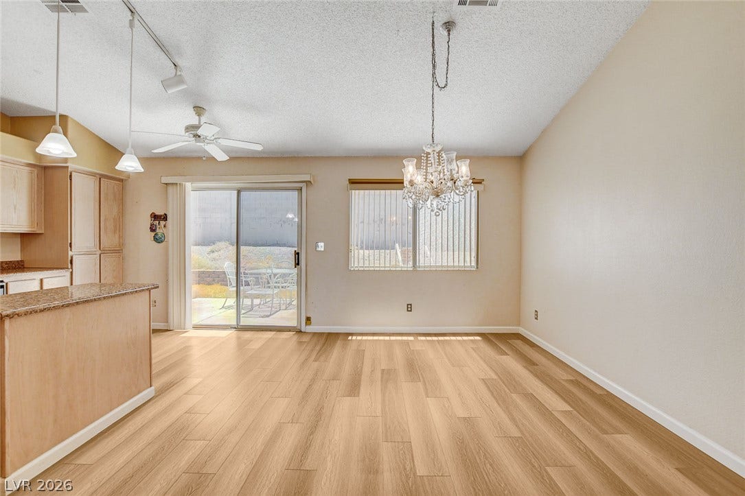 811 Rio Poco Court, Henderson, NV 89015 Warm wood flooring and vaulted ceilings create an open, airy dining space.