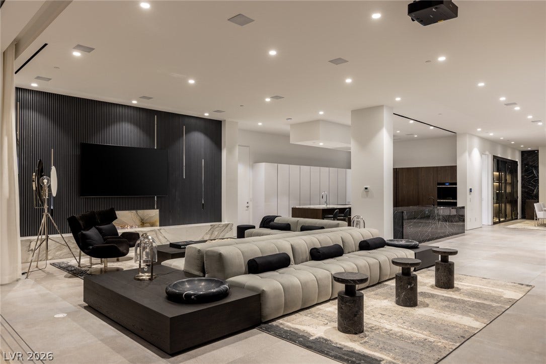 Experience modern living with a spacious open-concept design featuring a well-lit living area and an integrated kitchen.