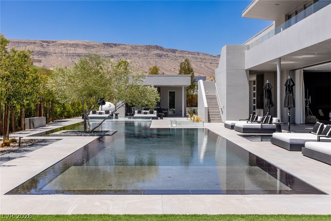 An inviting pool area with clean lines, ideal for warm-weather relaxation and entertainment.