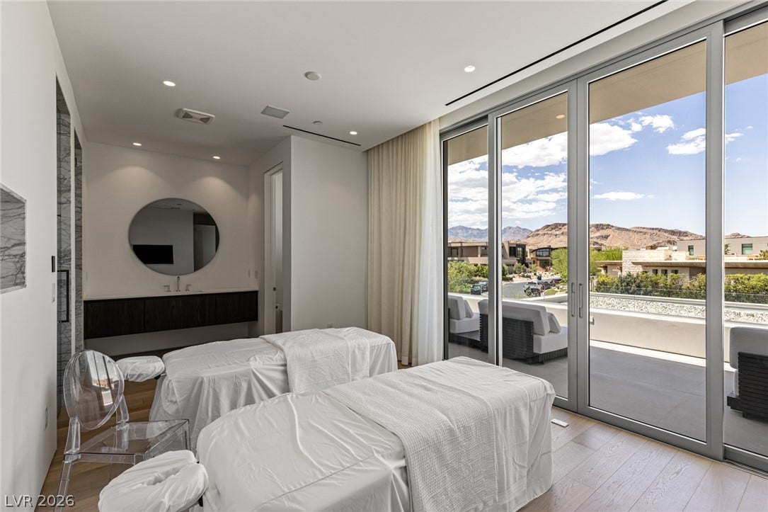 Indulge in relaxation with expansive mountain views from this serene interior space.