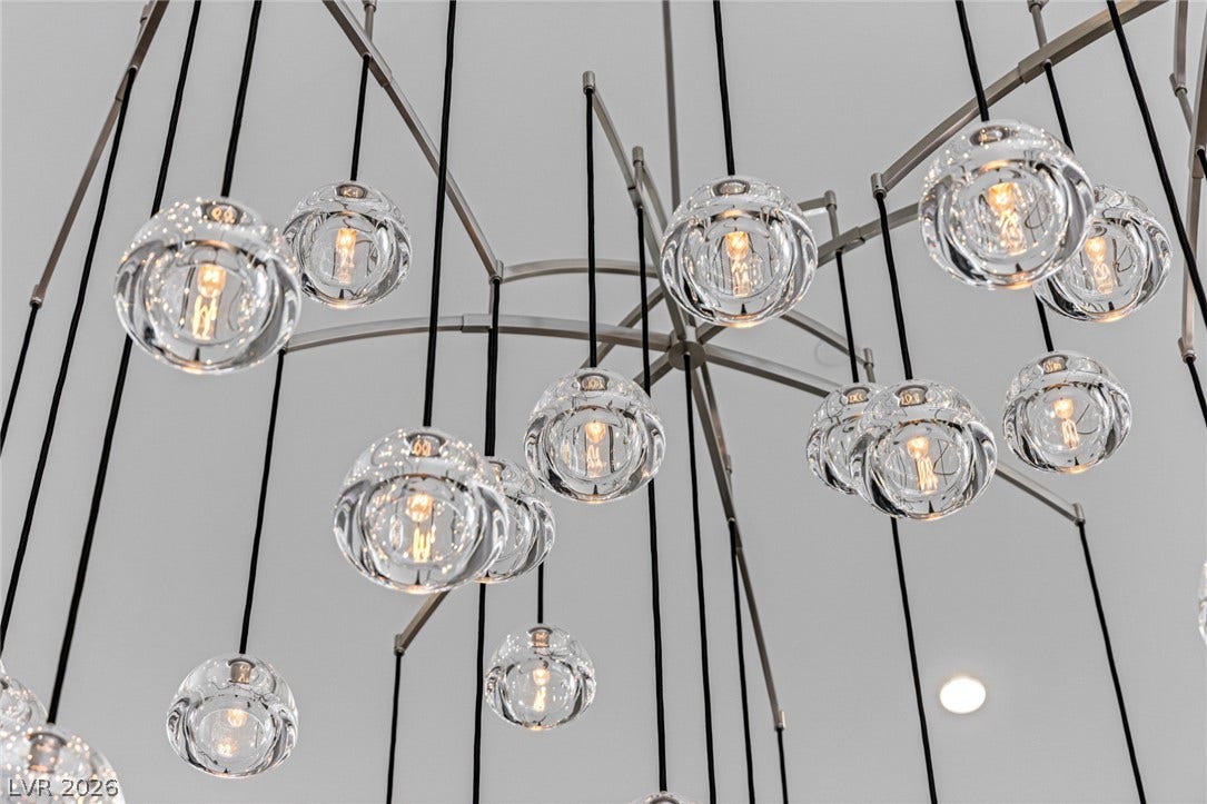 A captivating chandelier illuminates the interior with its unique, spherical design.